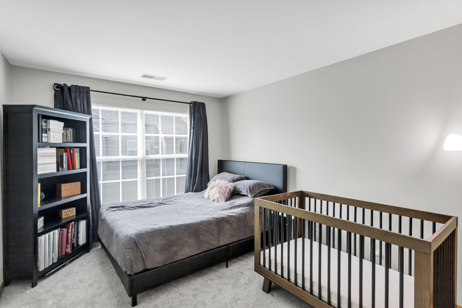 2262 Rockefeller Drive Geneva, IL 60134 - Photo 21 of 25 a bedroom with a bed and a book shelf