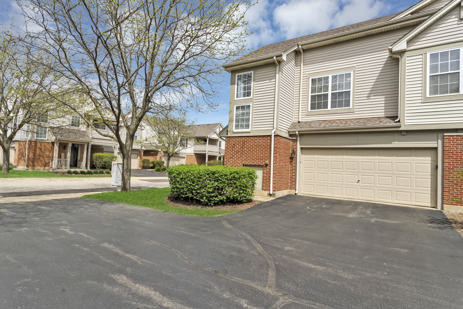 2262 Rockefeller Drive Geneva, IL 60134 - Photo 5 of 25 a front view of a house with a yard and garage