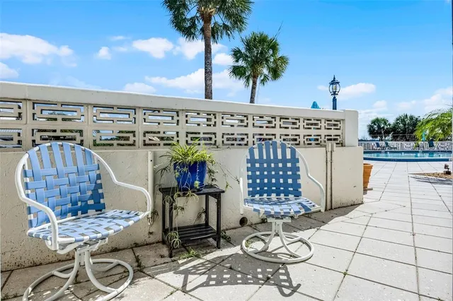 a view of a chairs and table on the terrace