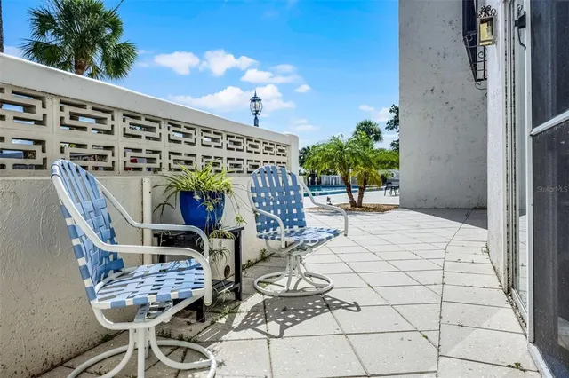 a view of an chairs and tables in the patio