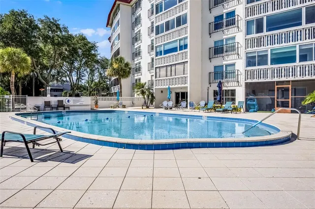 a view of a swimming pool with a lounge chairs