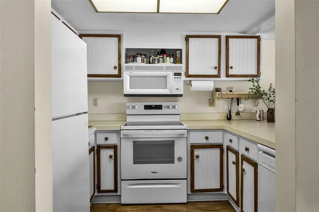 a kitchen with a stove and a refrigerator