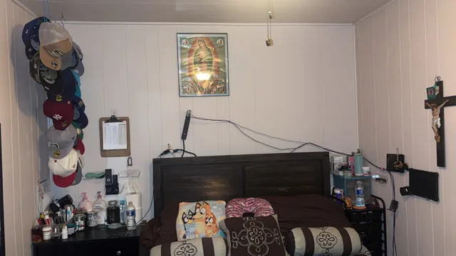 a front view of a house with entryway and wooden floor