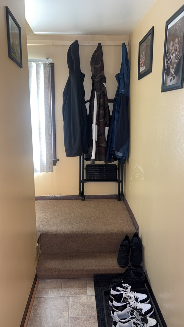 5614 South Kolmar Avenue Chicago, IL 60629 - Photo 17 of 40 a room with gym equipment and a window