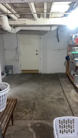 a view of a chair and table in the patio