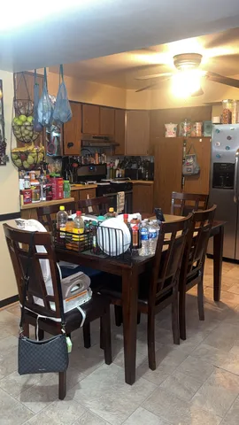 a outdoor dining space with furniture and a view of city