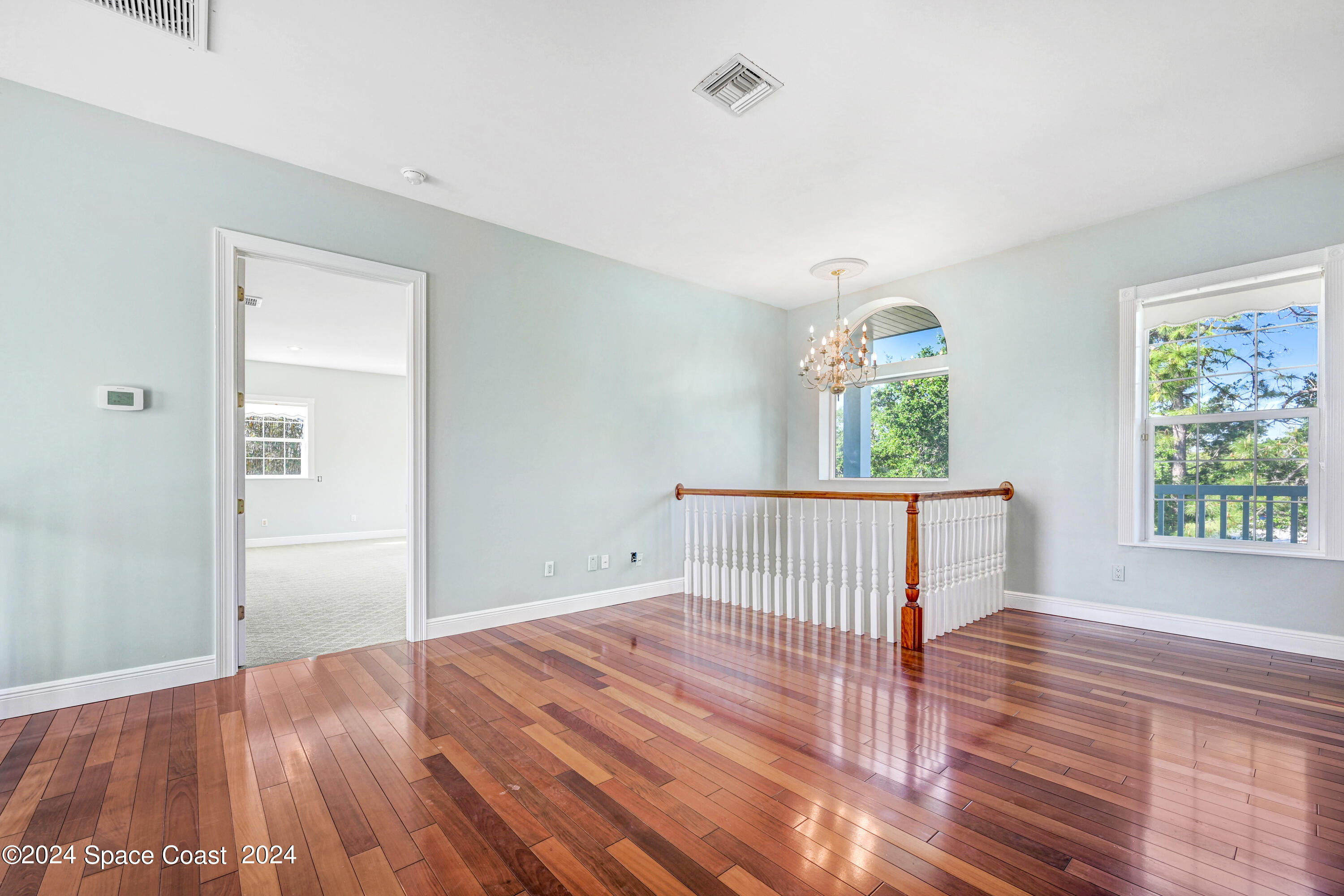 4383 Long Lake Road Melbourne, FL 32934 - Photo 26 of 58 a view of entryway with wooden floor