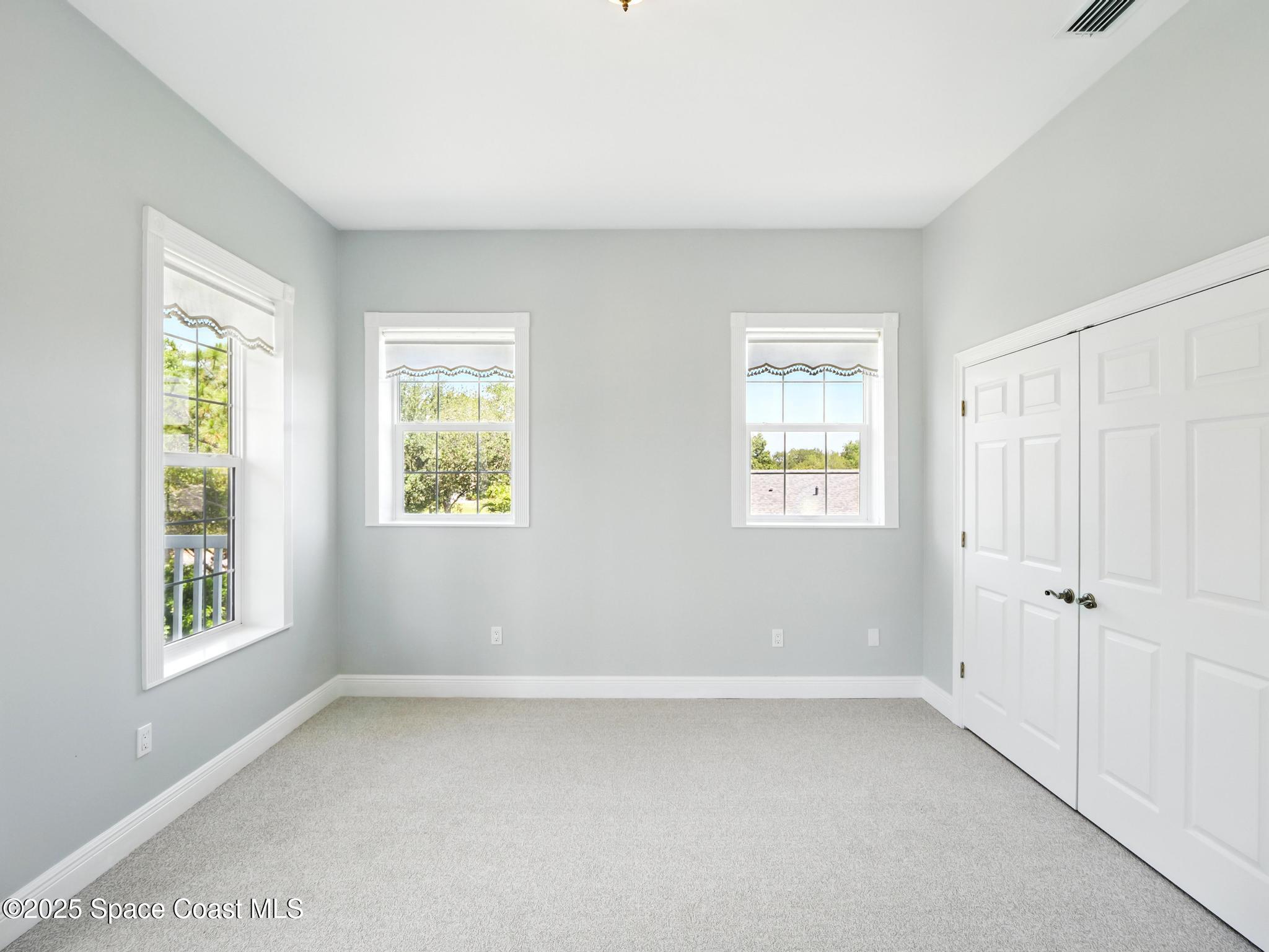 4383 Long Lake Road Melbourne, FL 32934 - Photo 30 of 58 a view of an empty room with a window