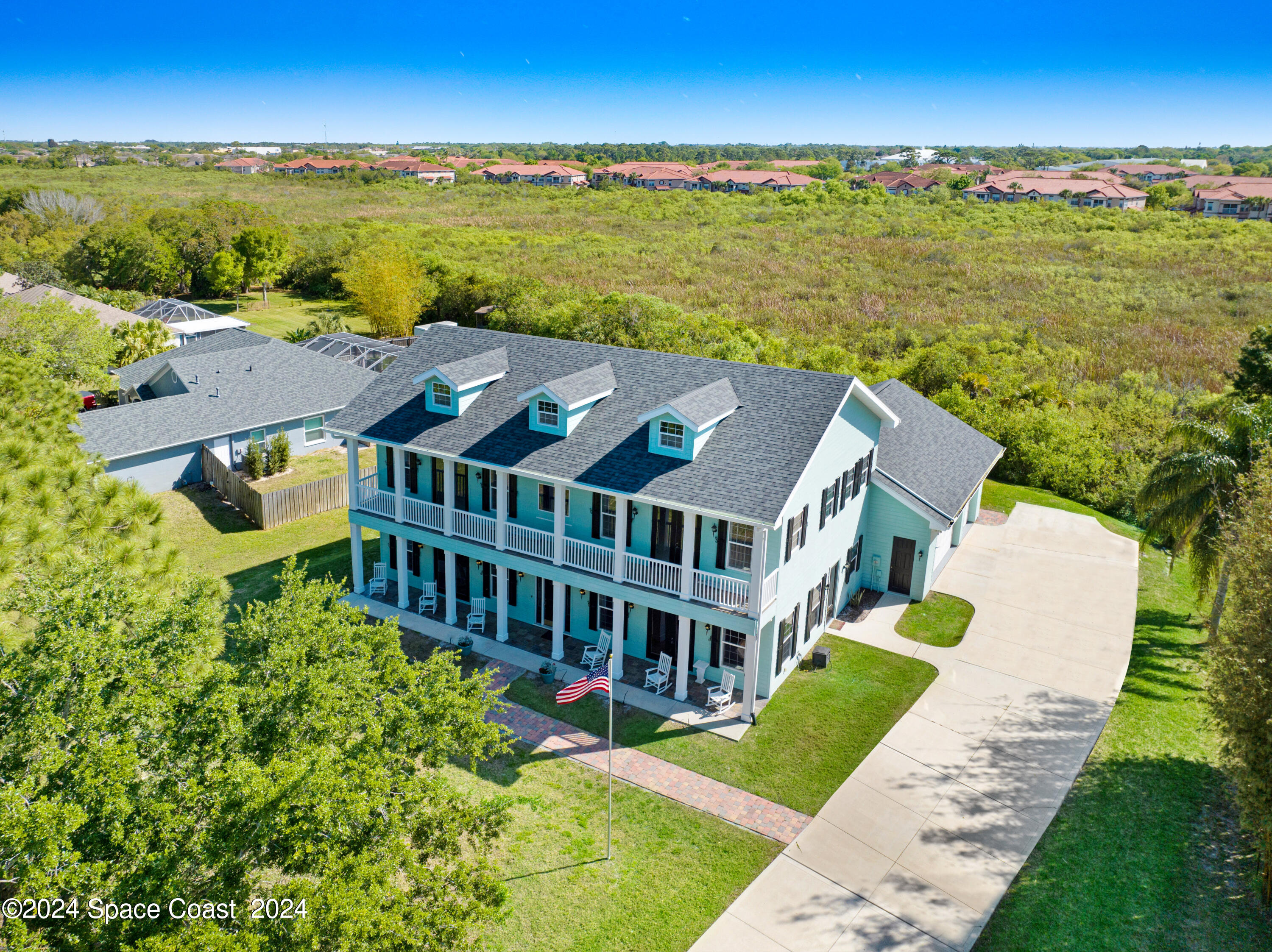 4383 Long Lake Road Melbourne, FL 32934 - Photo 4 of 58 a aerial view of a house with a ocean view