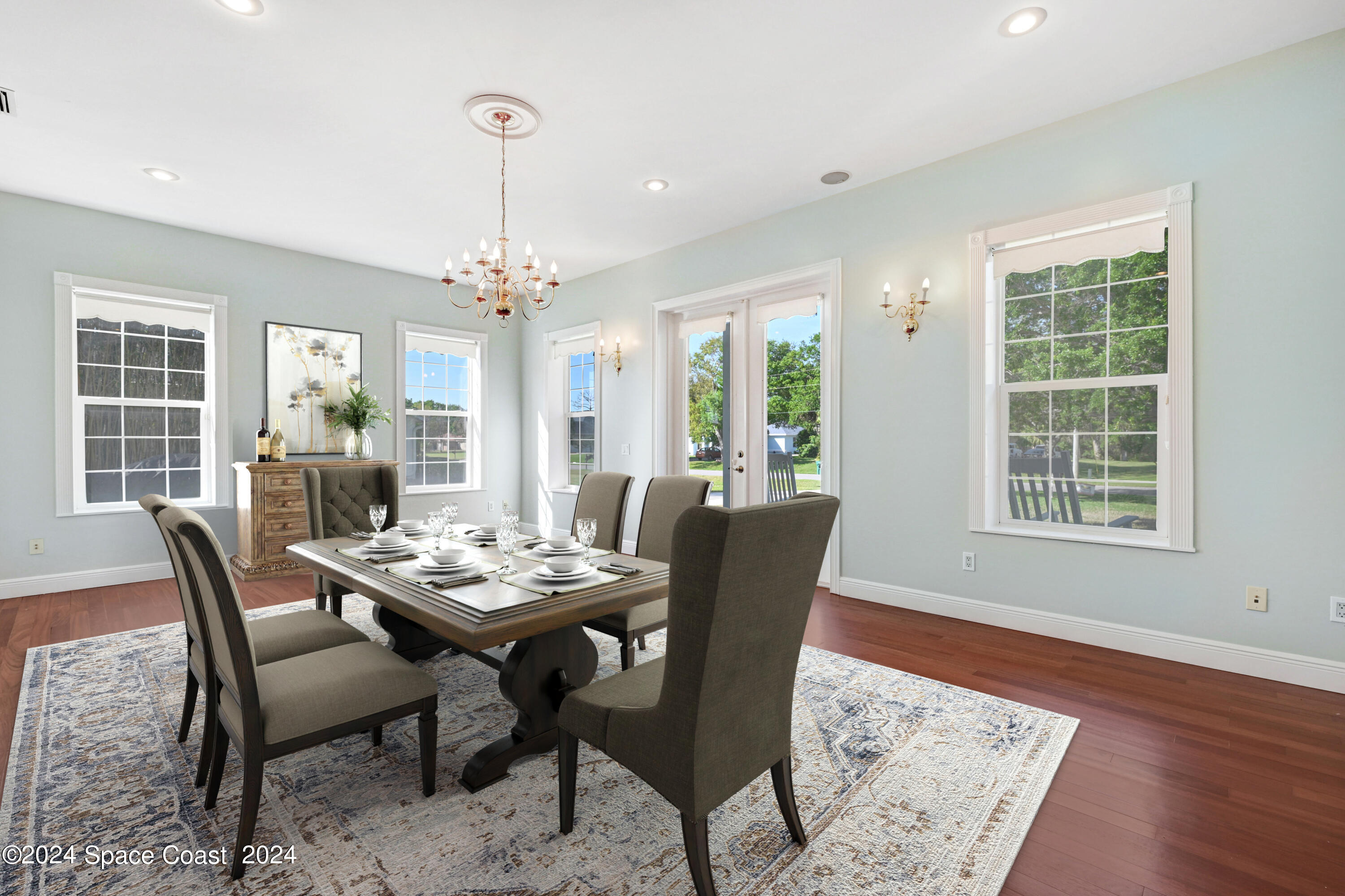 4383 Long Lake Road Melbourne, FL 32934 - Photo 41 of 58 a view of a dining room with furniture window and wooden floor