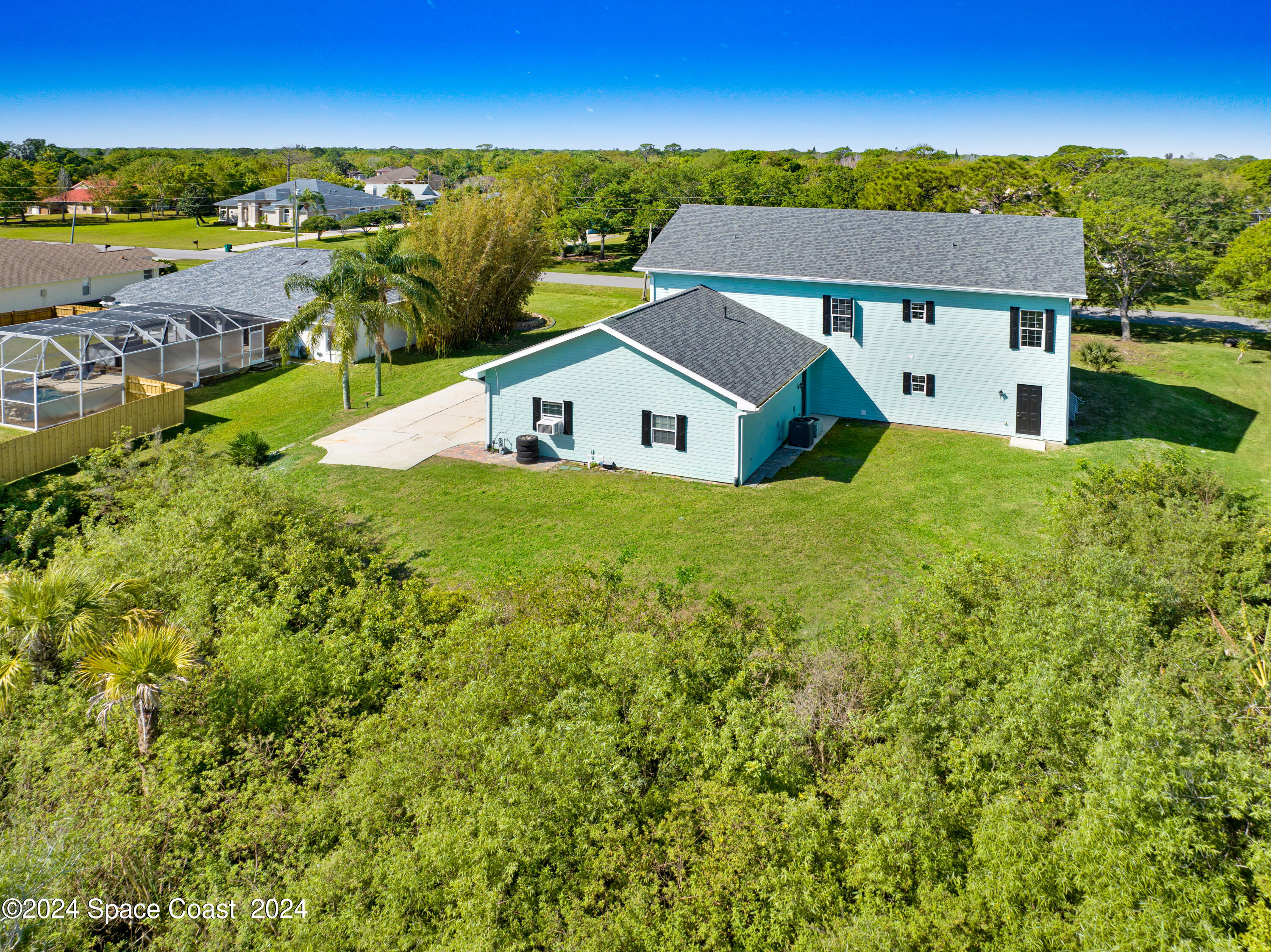 4383 Long Lake Road Melbourne, FL 32934 - Photo 45 of 58 an aerial view of house with yard and mountain view