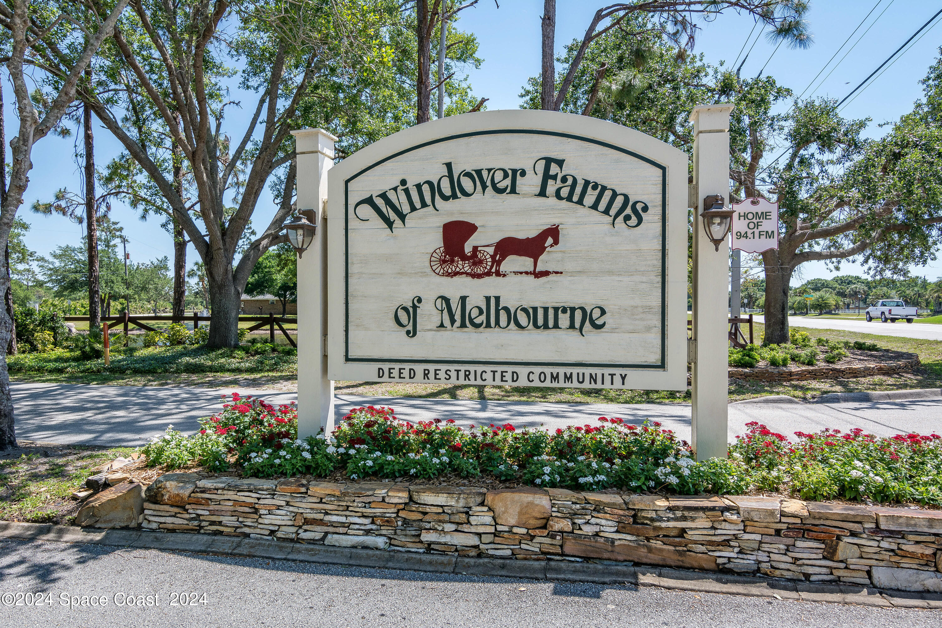 4383 Long Lake Road Melbourne, FL 32934 - Photo 47 of 58 a sign on the side of a street