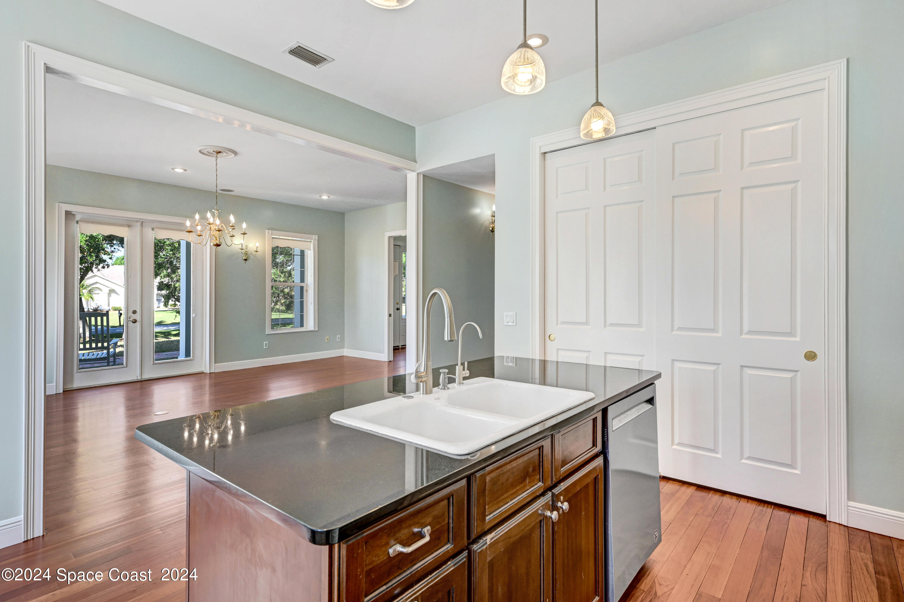 4383 Long Lake Road Melbourne, FL 32934 - Photo 10 of 58 a kitchen with center island table and chairs