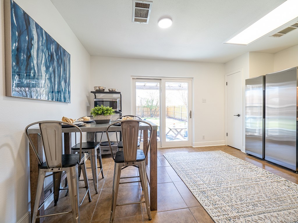 3257 Elizabeth Anne Lane Round Rock, TX 78664 - Photo 11 of 31 a view of a dining room with furniture and a window