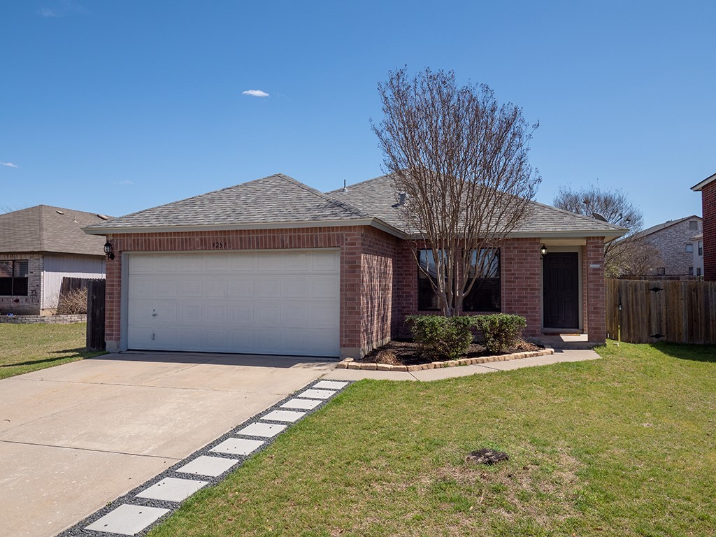 3257 Elizabeth Anne Lane Round Rock, TX 78664 - Photo 2 of 31 a front view of a house with garden