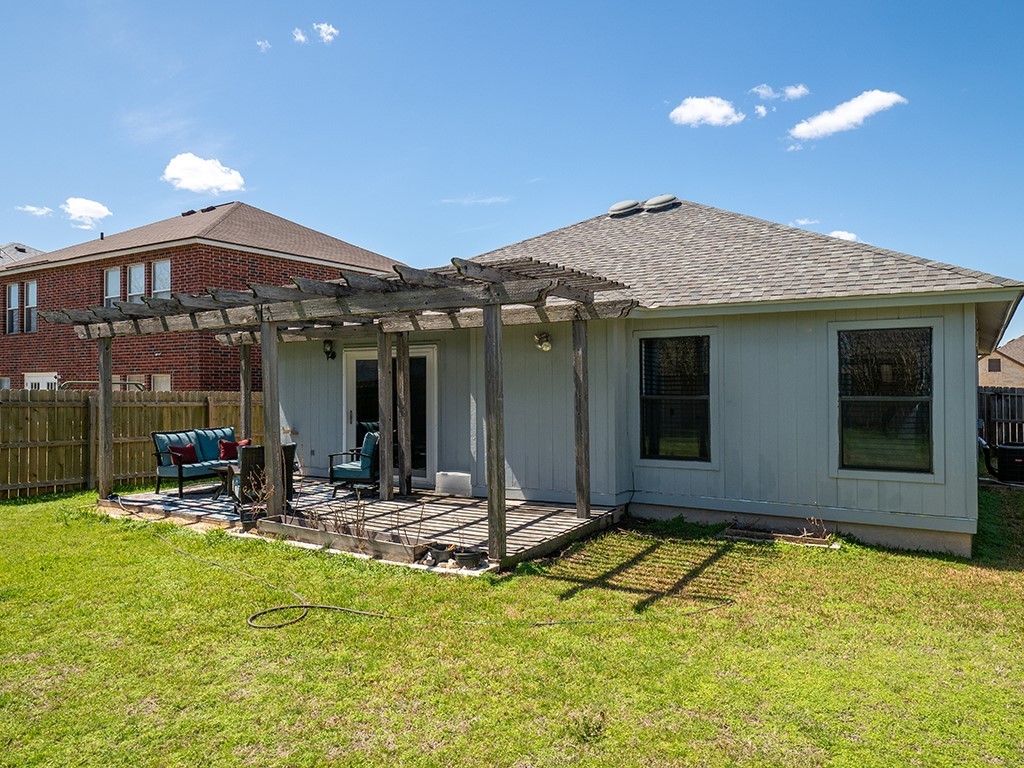 3257 Elizabeth Anne Lane Round Rock, TX 78664 - Photo 24 of 31 a backyard of a house with table and chairs