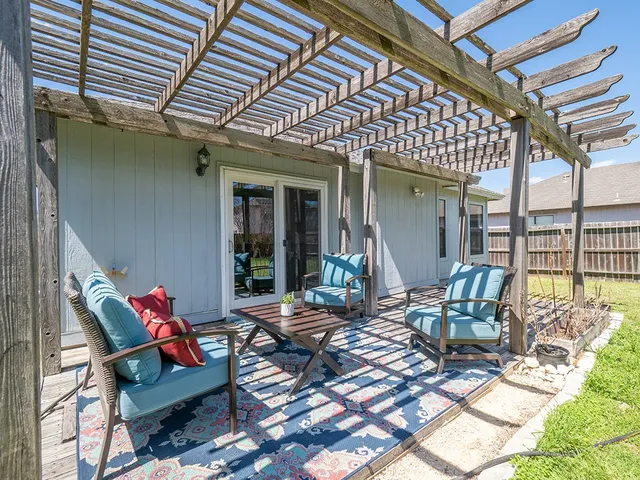 a view of swimming pool with outdoor seating