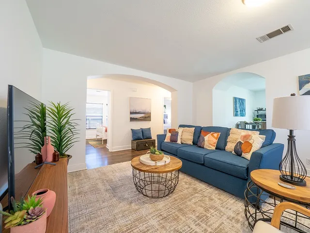 a living room with furniture and a large window