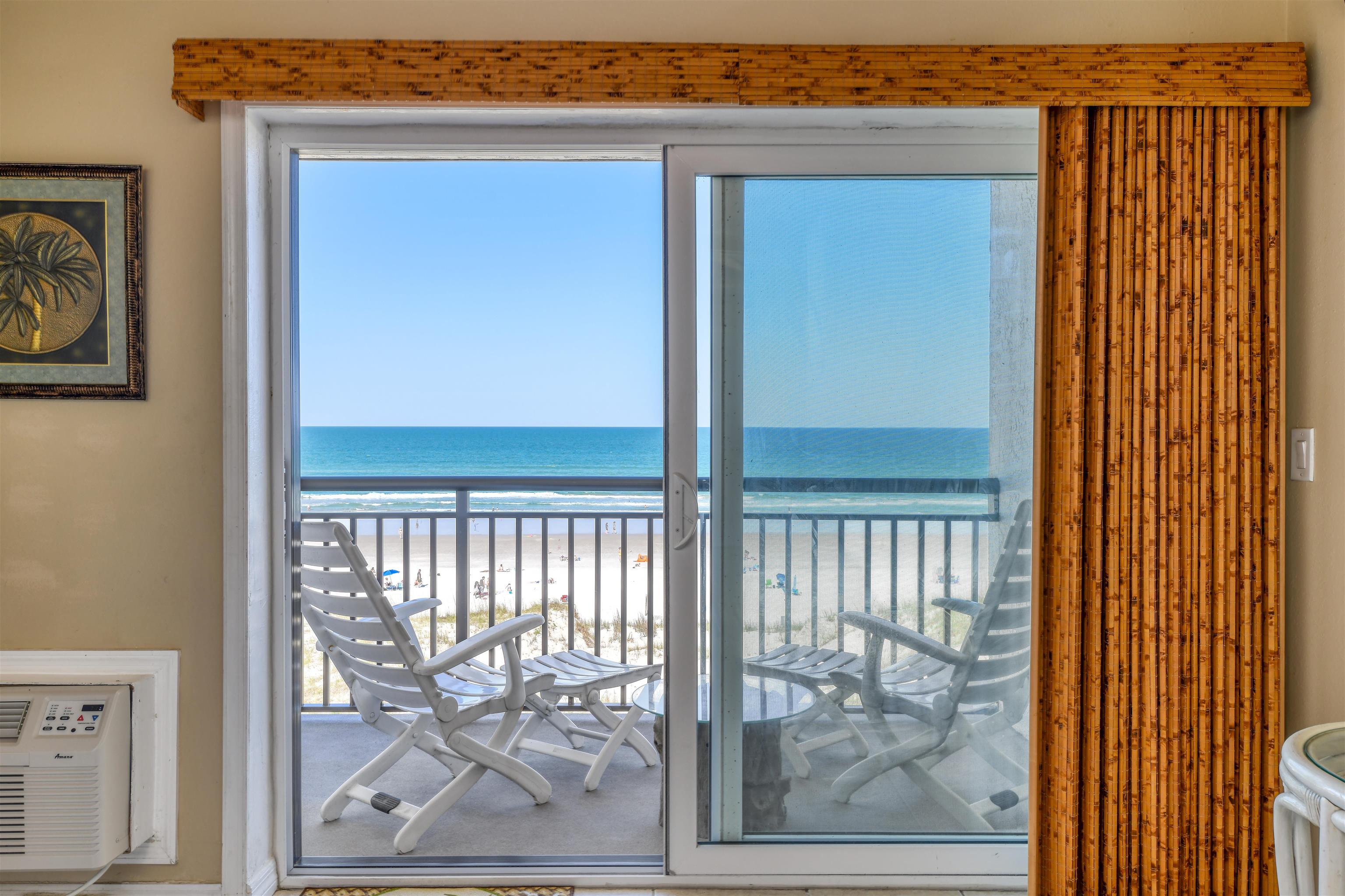 6970 A1A South, Unit 433 St. Augustine, FL 32080 - Photo 12 of 36 a view of a porch with a door and wooden floor