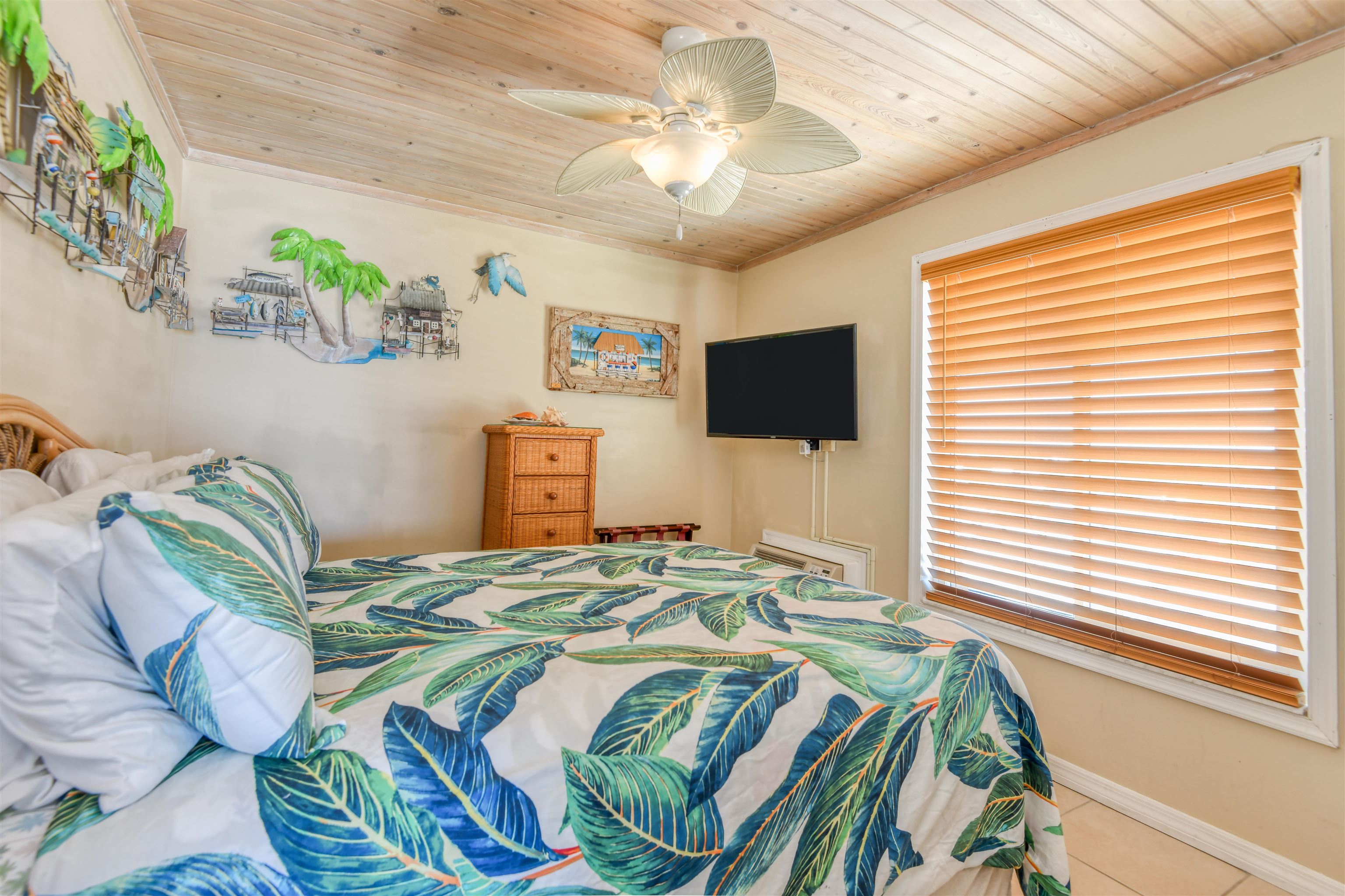 6970 A1A South, Unit 433 St. Augustine, FL 32080 - Photo 17 of 36 a bedroom with a bed and a flat screen tv