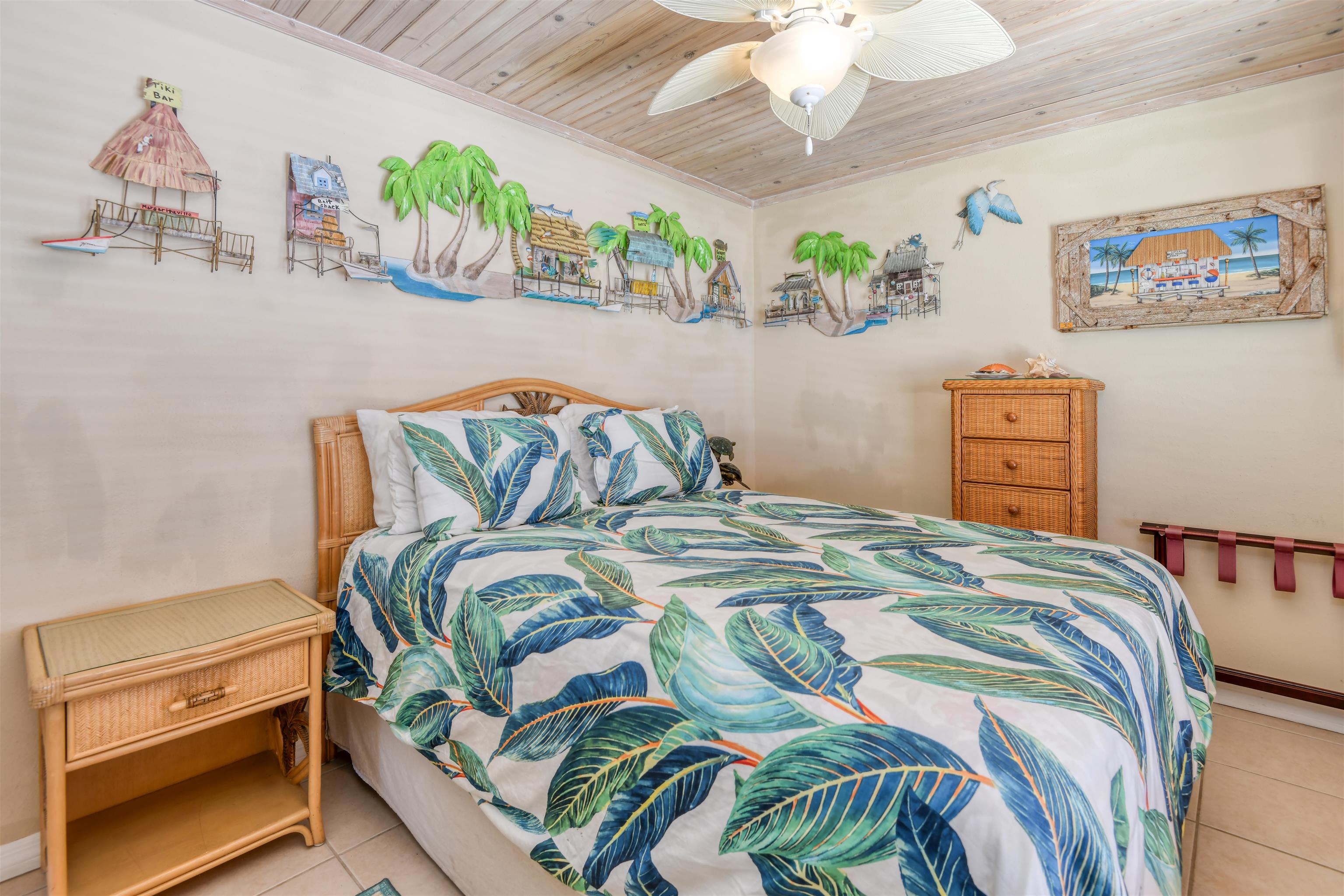 6970 A1A South, Unit 433 St. Augustine, FL 32080 - Photo 18 of 36 a bedroom with a bed and a chandelier