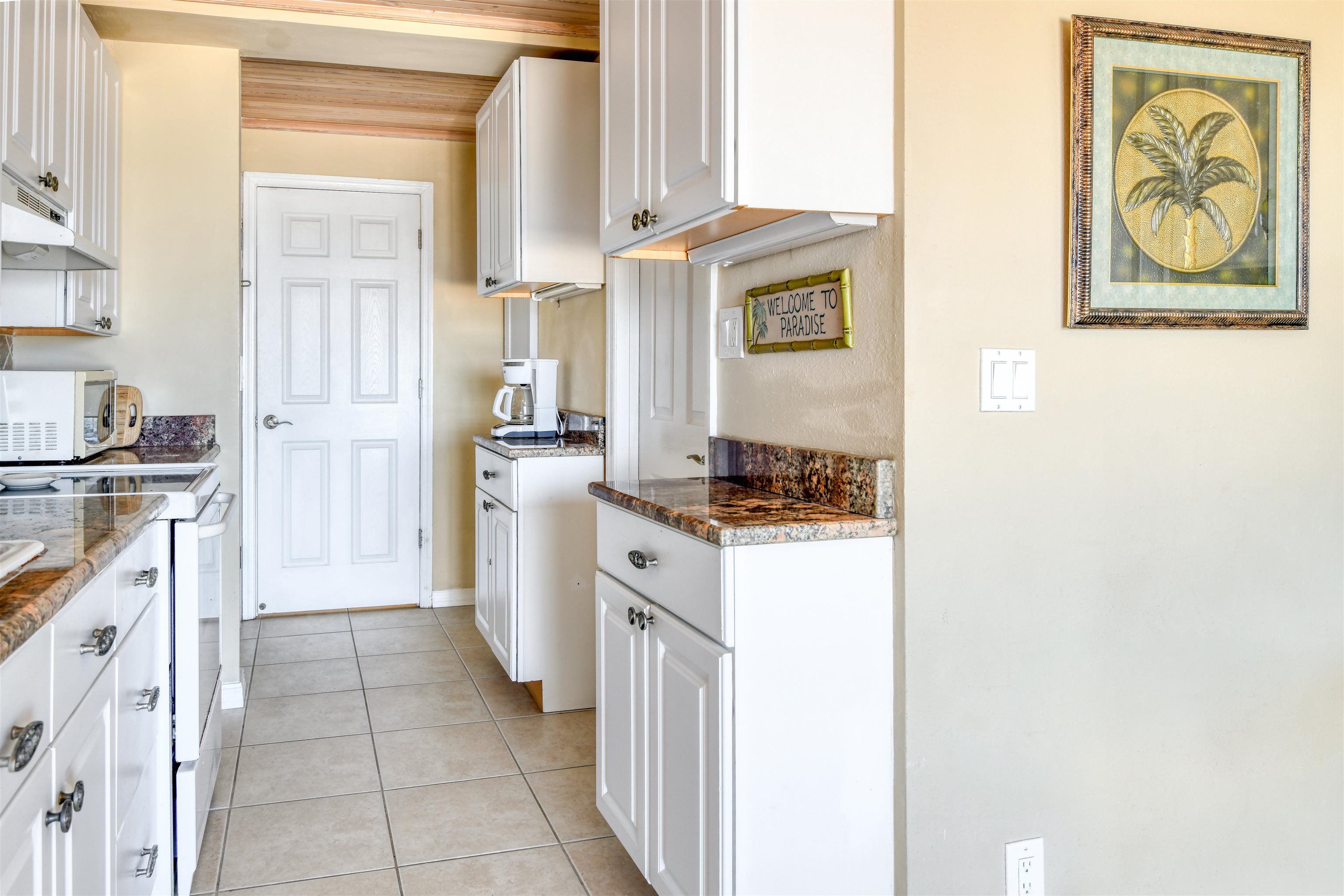 6970 A1A South, Unit 433 St. Augustine, FL 32080 - Photo 5 of 36 a kitchen with a refrigerator and a stove
