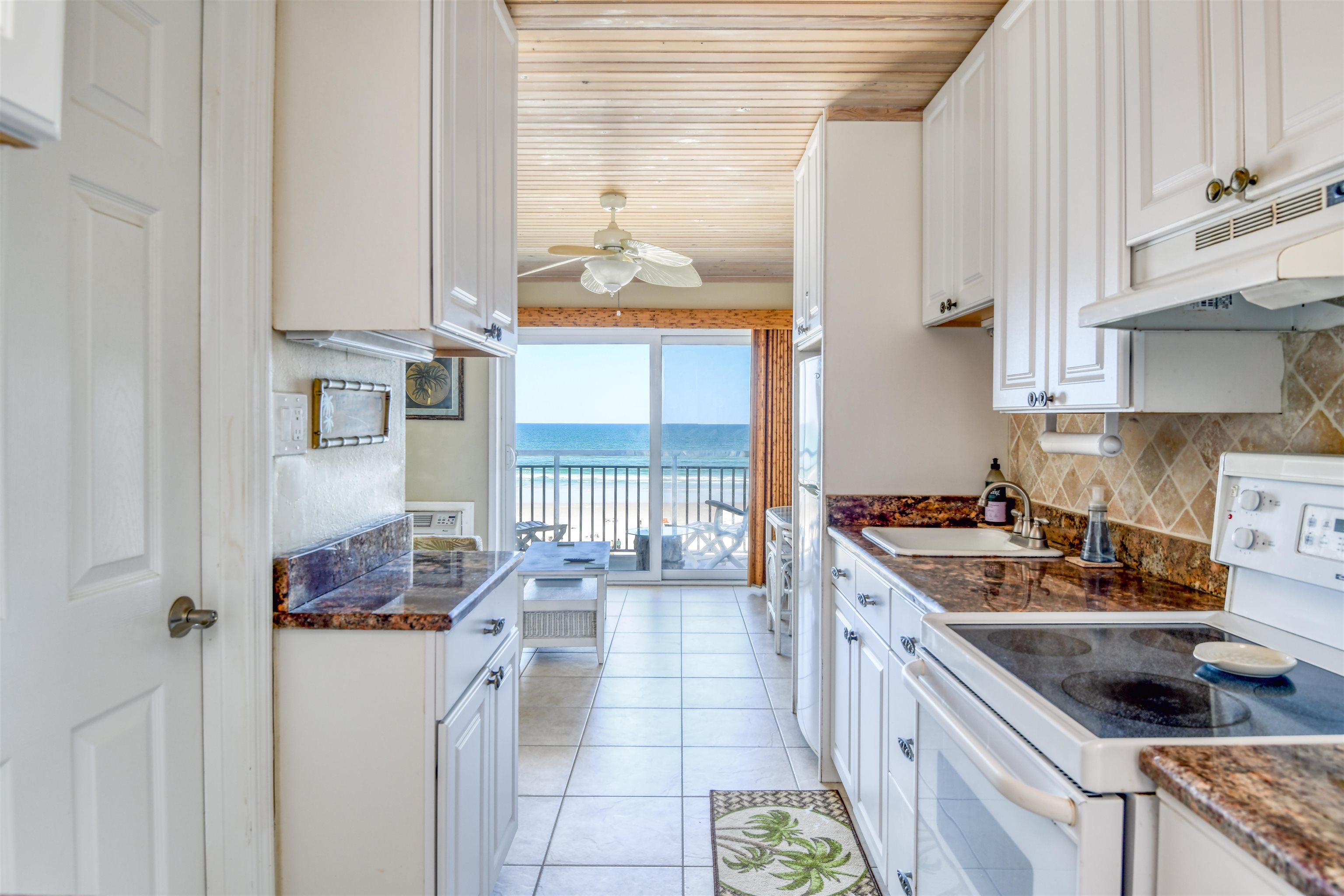 6970 A1A South, Unit 433 St. Augustine, FL 32080 - Photo 6 of 36 a kitchen with stainless steel appliances granite countertop a sink stove and cabinets