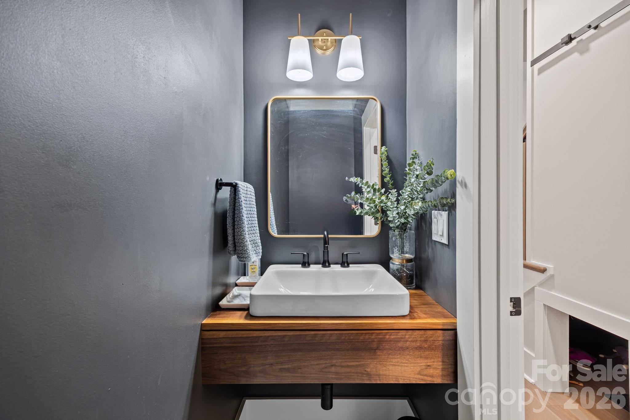 241 North Faulkner Way Davidson, NC 28036 - Photo 25 of 39 a room with painting on the wall and a potted plant