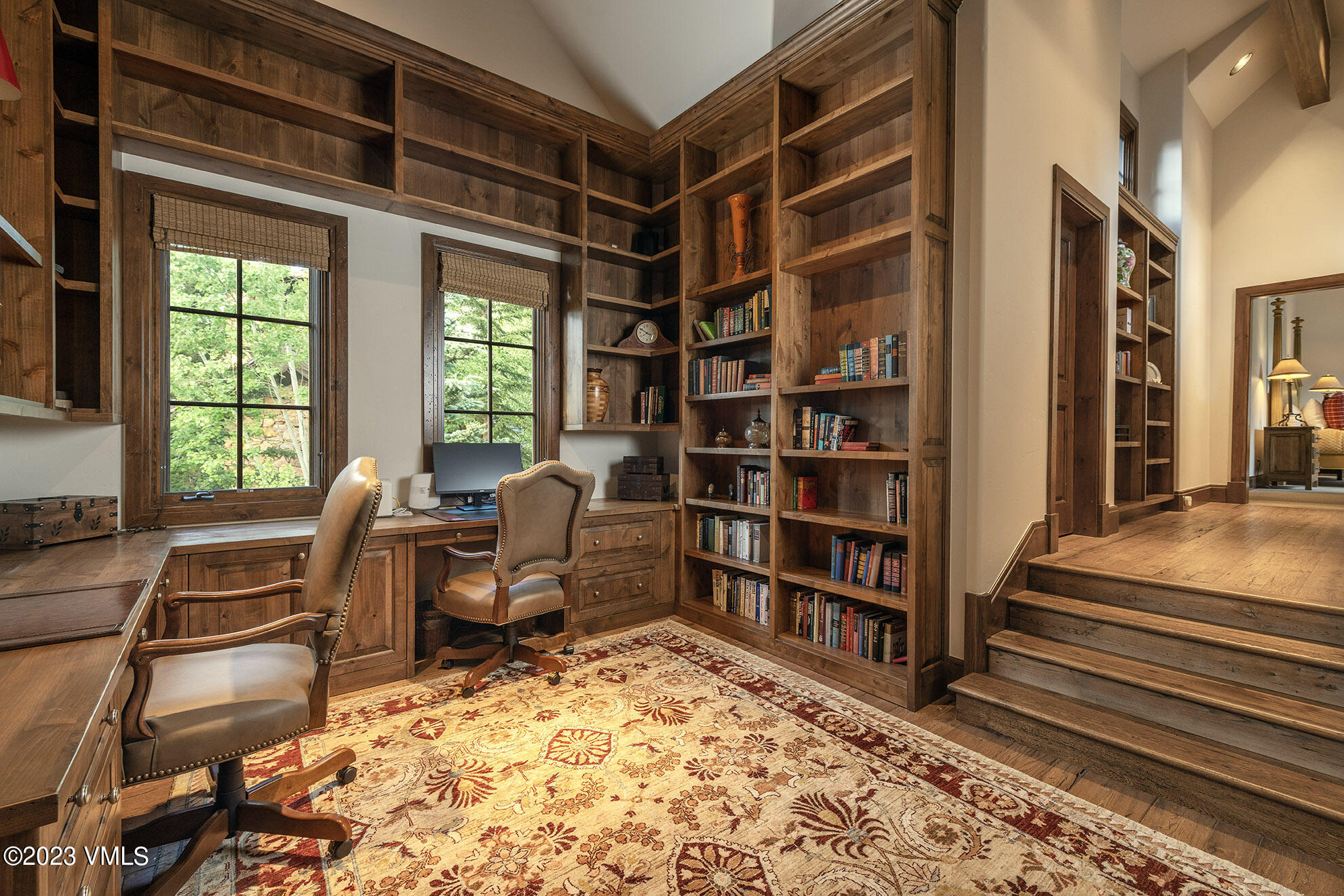 2156 Cresta Road Edwards, CO 81632 - Photo 13 of 19 a view of a workspace with furniture and a bookshelf