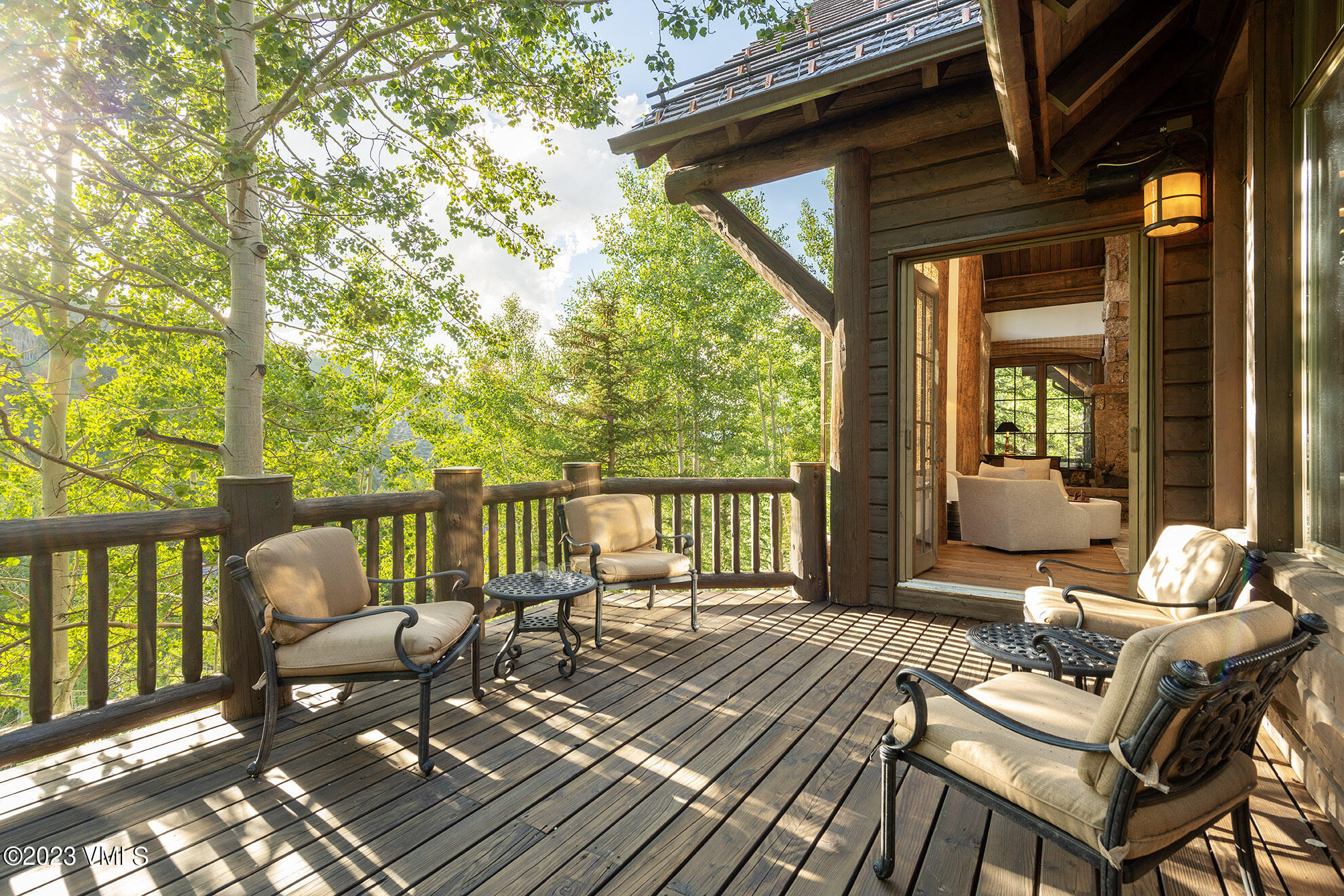 2156 Cresta Road Edwards, CO 81632 - Photo 18 of 19 a balcony with wooden floor table and chairs
