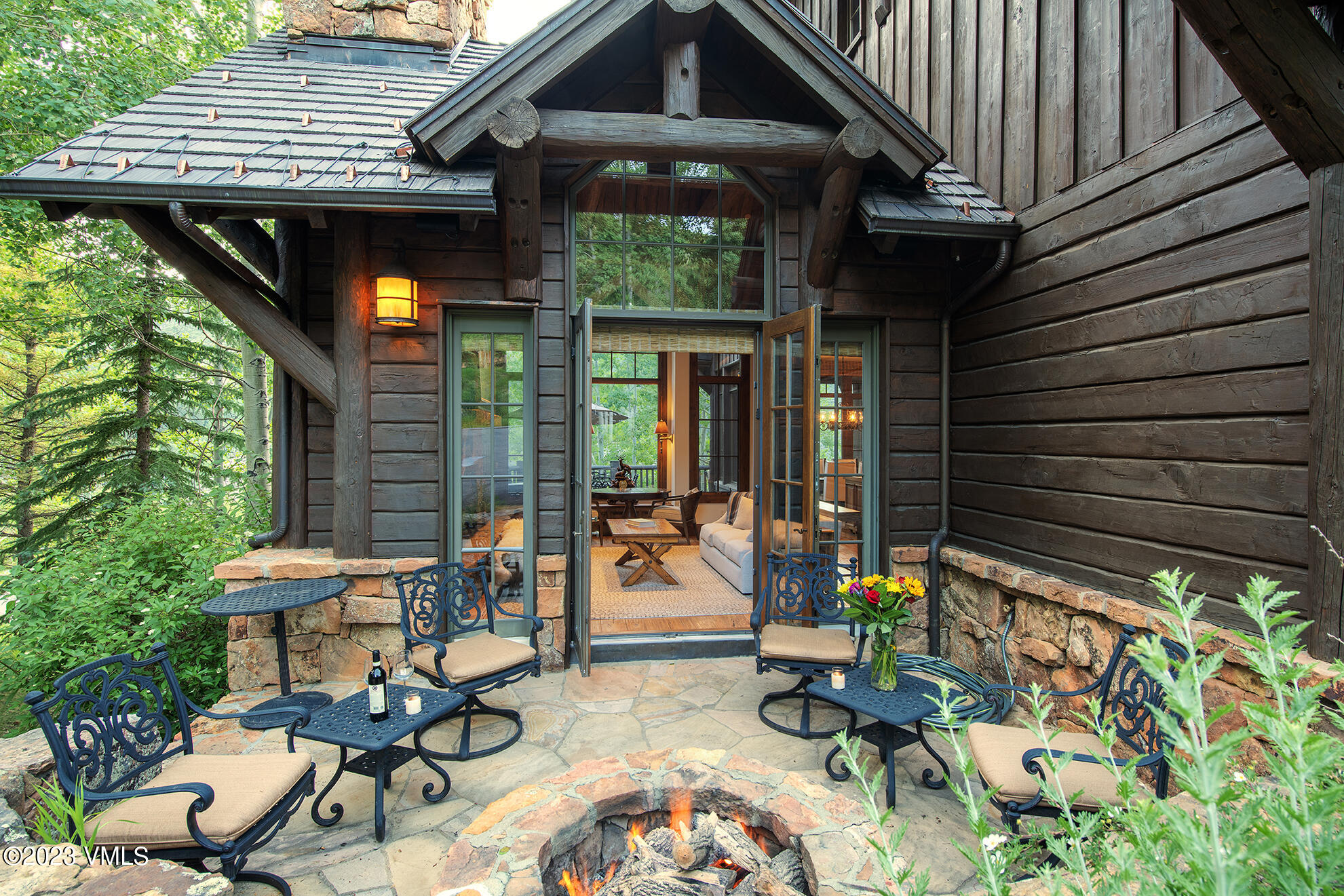 2156 Cresta Road Edwards, CO 81632 - Photo 2 of 19 a view of a patio with table and chairs and potted plants