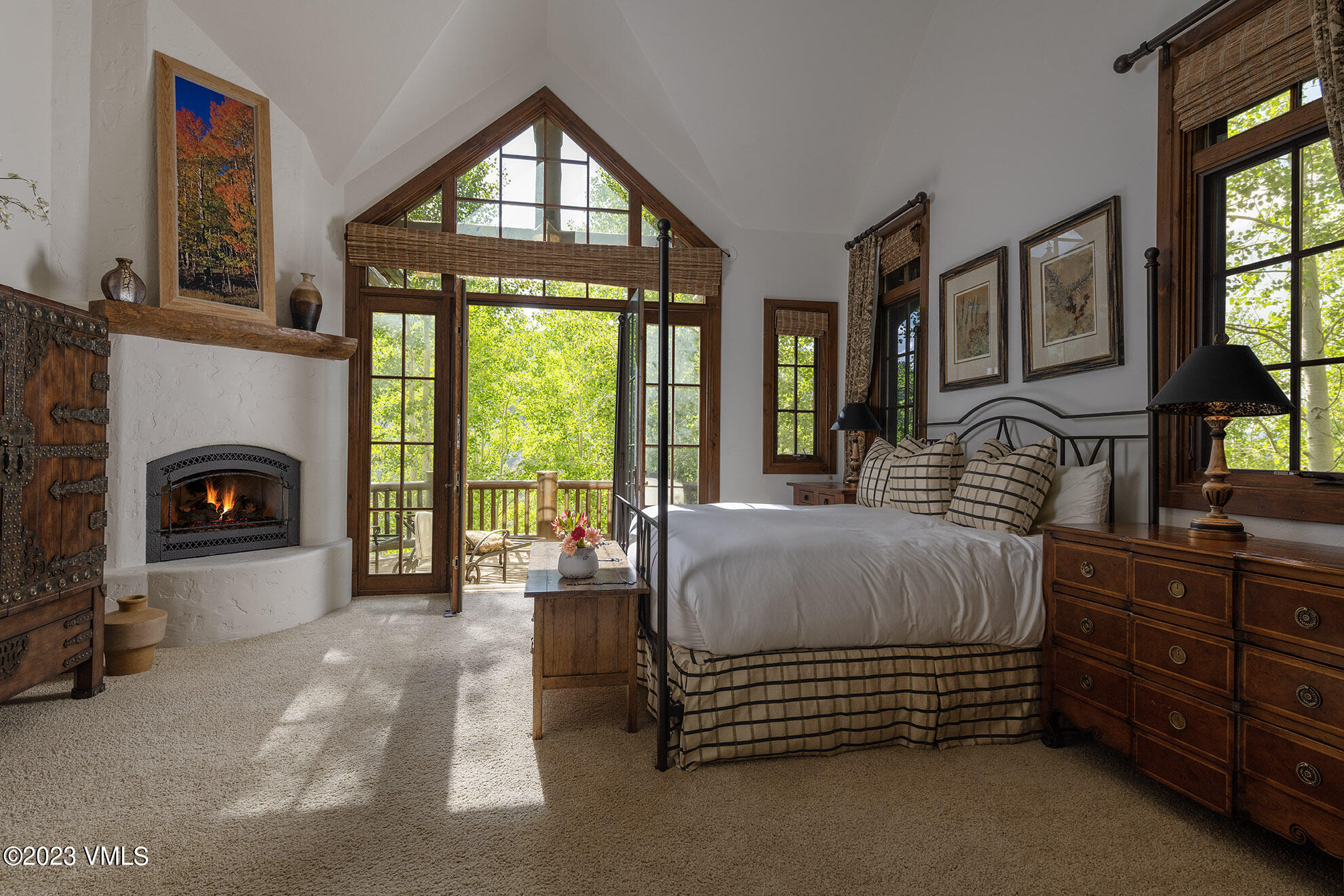 2156 Cresta Road Edwards, CO 81632 - Photo 4 of 19 a spacious bedroom with a bed and a fireplace next to a window