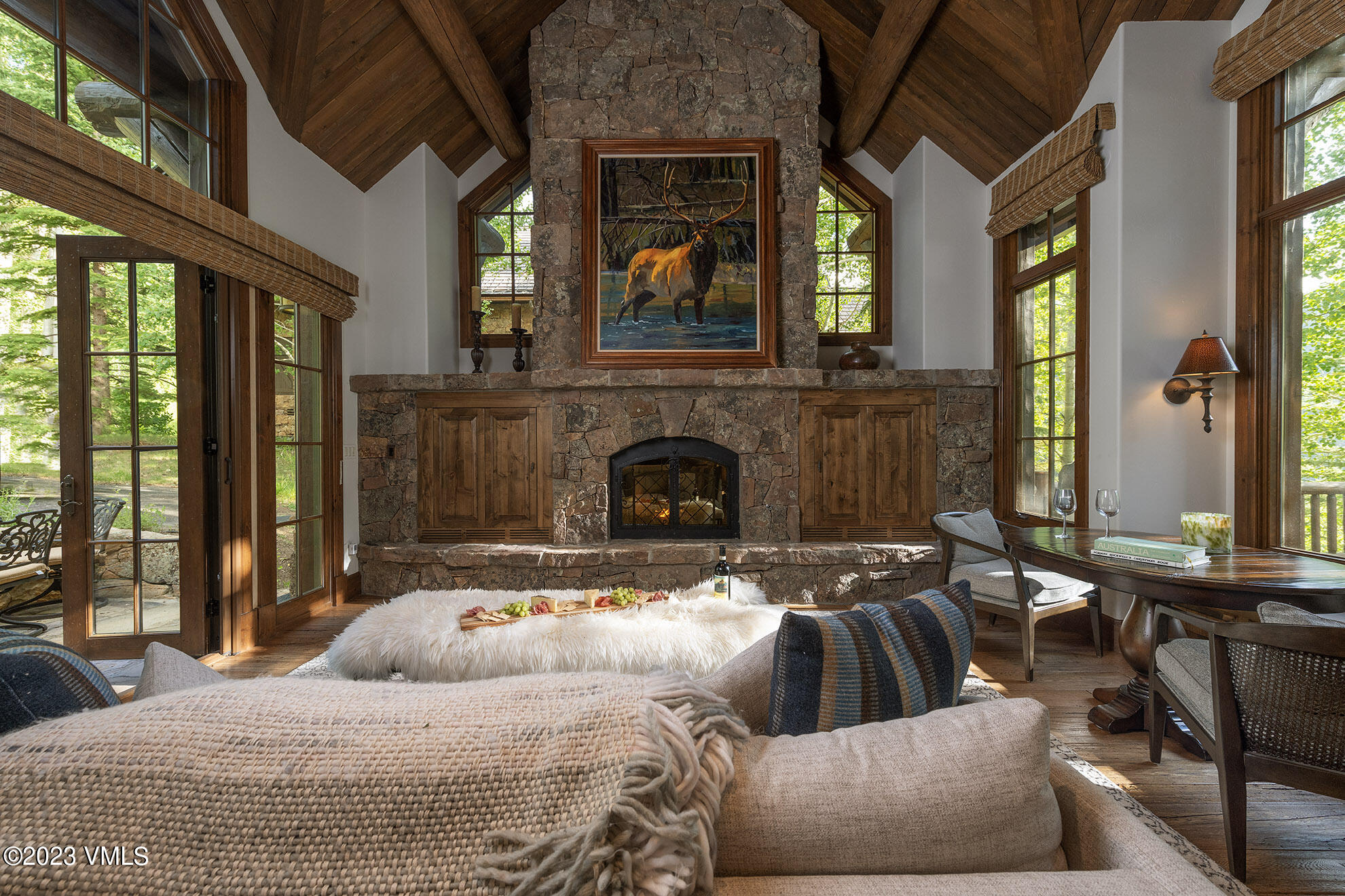 2156 Cresta Road Edwards, CO 81632 - Photo 6 of 19 a large bedroom with a large bed a flat tv screen and a fireplace with the balcony