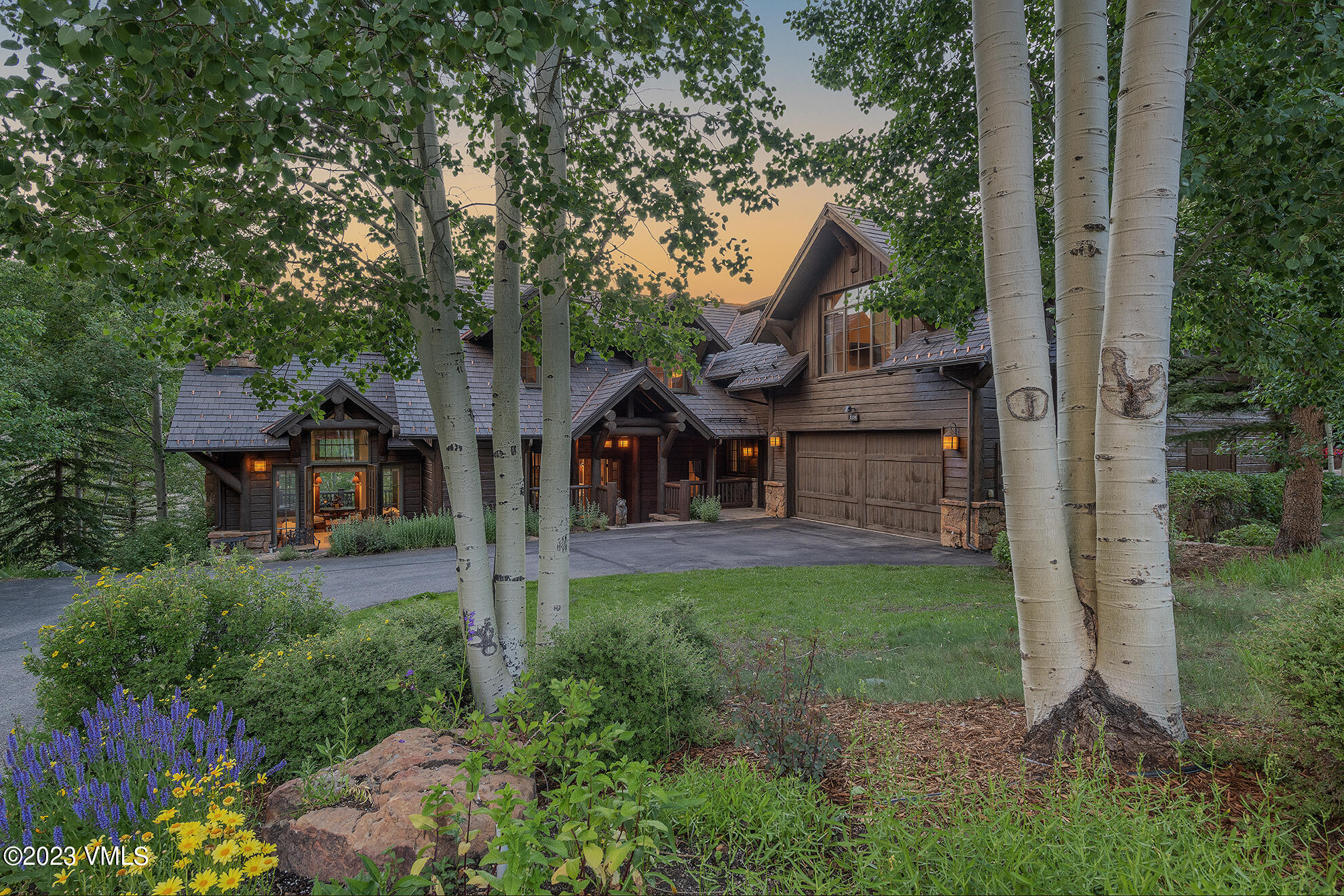 2156 Cresta Road Edwards, CO 81632 - Photo 9 of 19 a front view of a house with garden