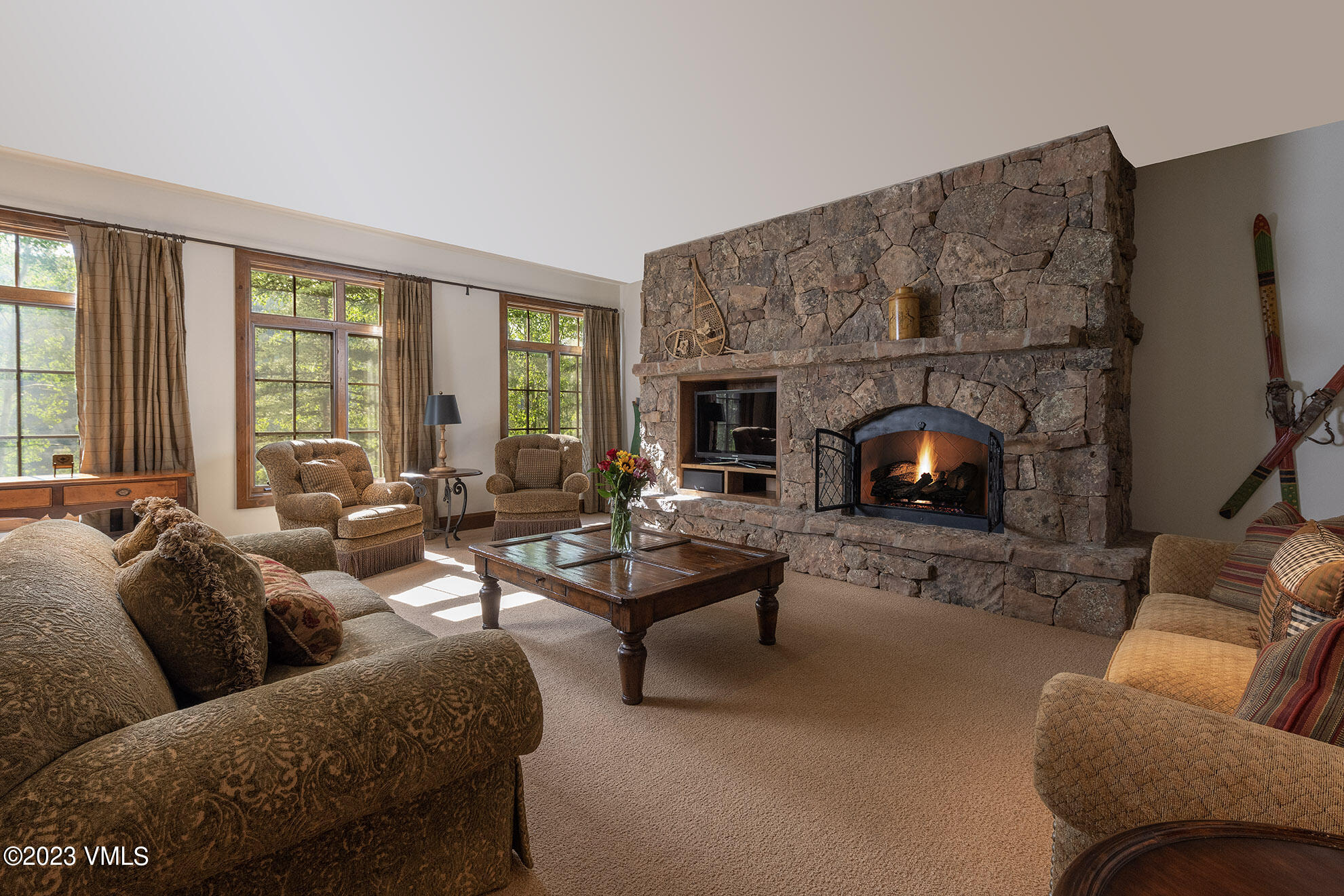 2156 Cresta Road Edwards, CO 81632 - Photo 10 of 19 a living room with furniture fireplace and a large window