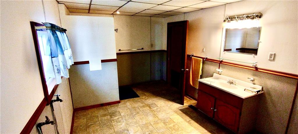 721 South 88th Road Carmichaels, PA 15320 - Photo 15 of 27 Large bathroom with a wide vanity, standup shower, and laundry