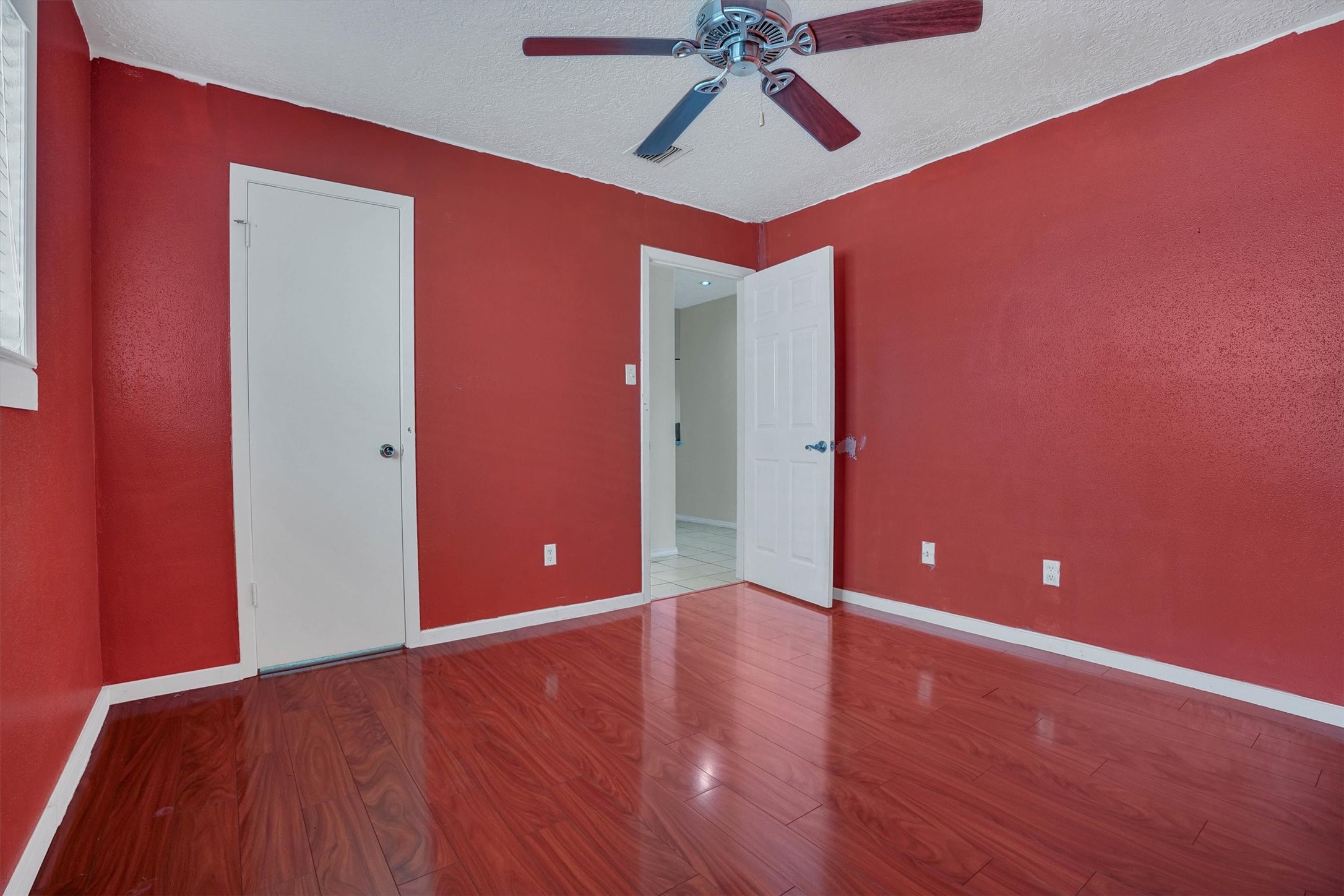 2310 Keyhole Lane Houston, TX 77084 - Photo 18 of 40 a view of an empty room with wooden floor