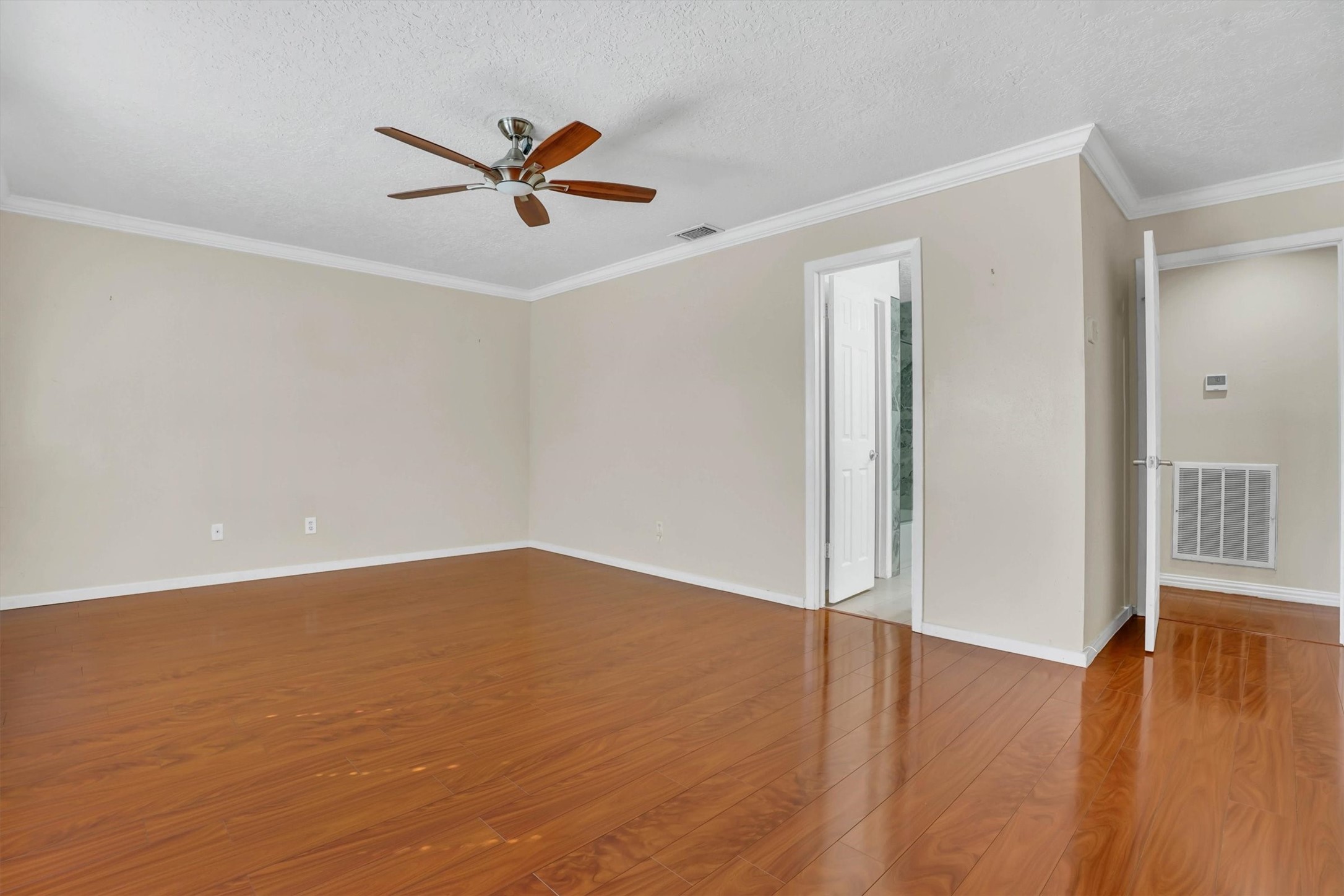 2310 Keyhole Lane Houston, TX 77084 - Photo 30 of 40 an empty room with wooden floor and windows