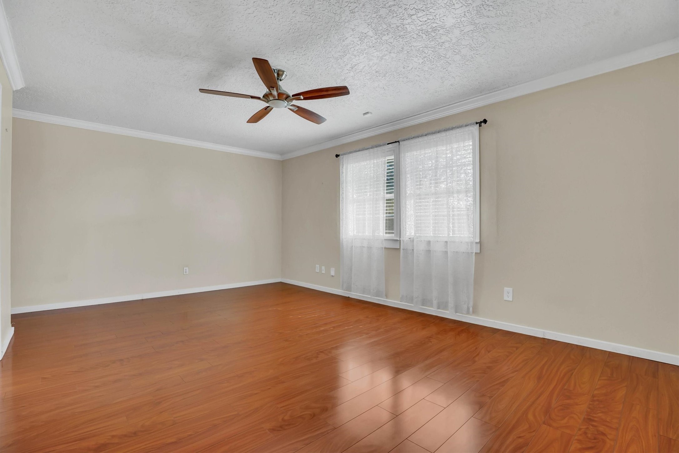 2310 Keyhole Lane Houston, TX 77084 - Photo 31 of 40 a view of an empty room with wooden floor and a window