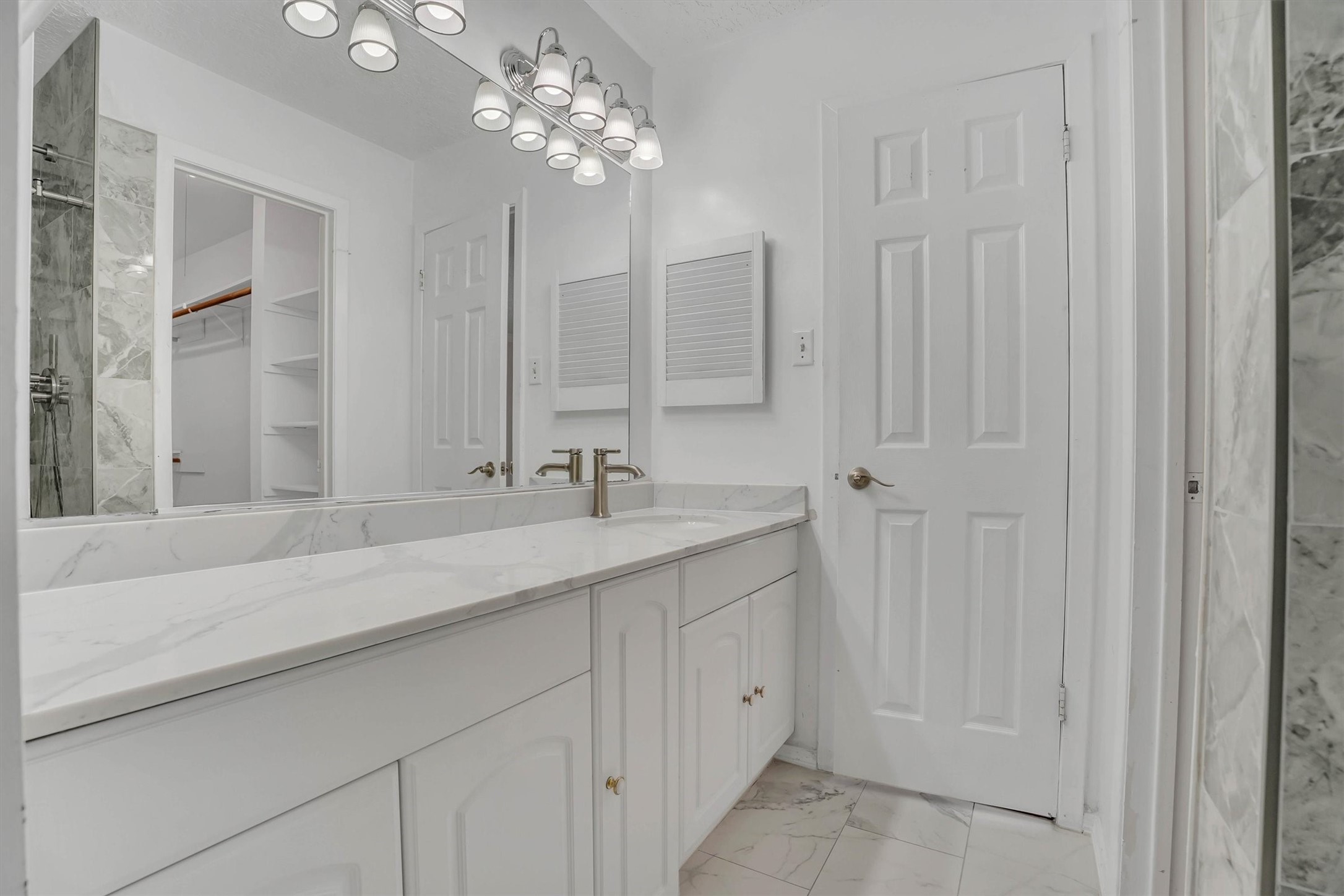 2310 Keyhole Lane Houston, TX 77084 - Photo 32 of 40 a bathroom with a double vanity sink and a mirror