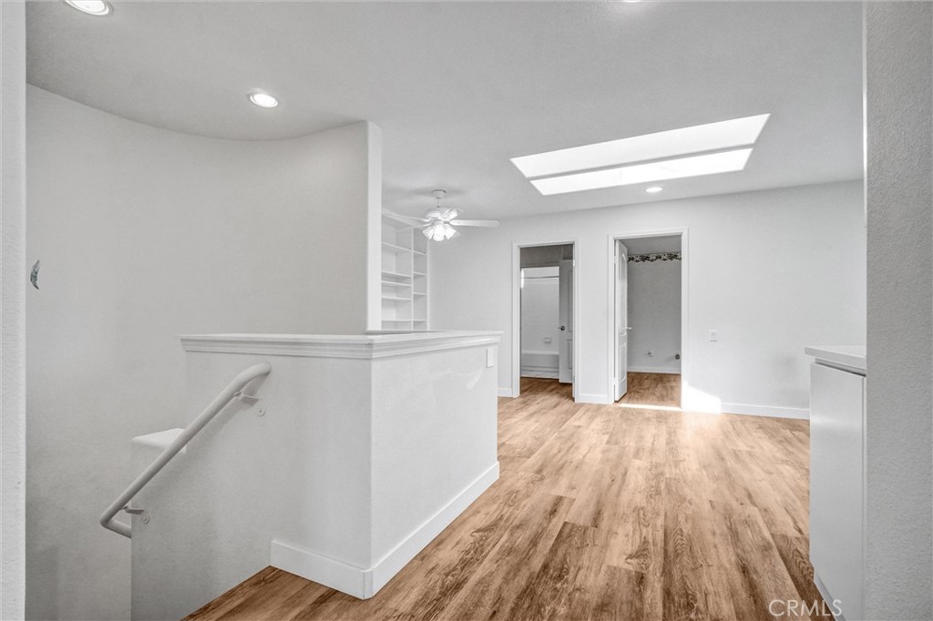 19581 Dorado Drive Lake Forest, CA 92679 - Photo 17 of 32 a view of a hallway with wooden floor