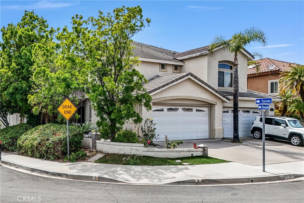 19581 Dorado Drive Lake Forest, CA 92679 - Photo 2 of 32 a view of house and a yard