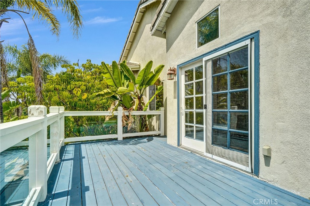 19581 Dorado Drive Lake Forest, CA 92679 - Photo 23 of 32 a view of balcony with wooden floor and potted plants