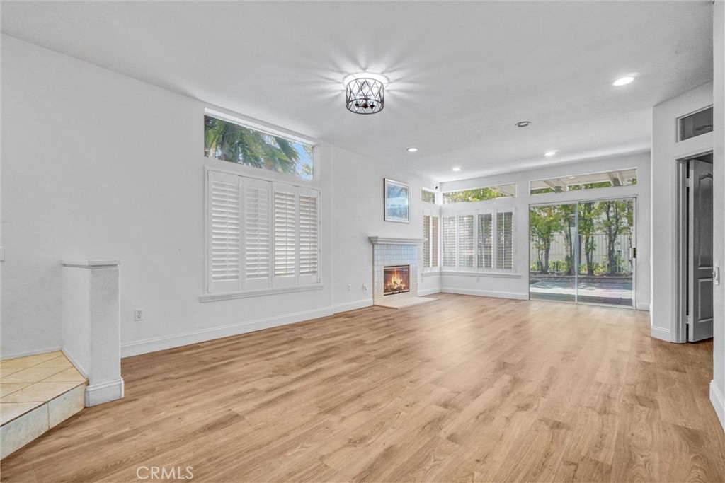 19581 Dorado Drive Lake Forest, CA 92679 - Photo 5 of 32 a view of an empty room with a window and wooden floor