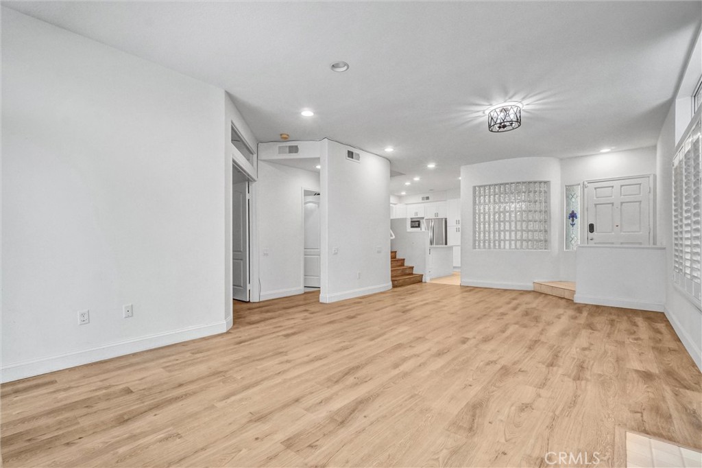 19581 Dorado Drive Lake Forest, CA 92679 - Photo 6 of 32 a view of an empty room with wooden floor
