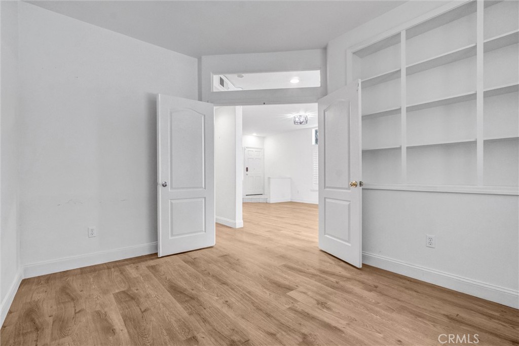 19581 Dorado Drive Lake Forest, CA 92679 - Photo 8 of 32 a view of empty room with wooden floor and cabinet