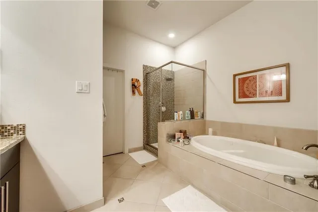 a bathroom with a granite countertop sink mirror and double