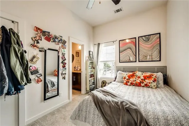 a bathroom with a large tub a sink a mirror and shower