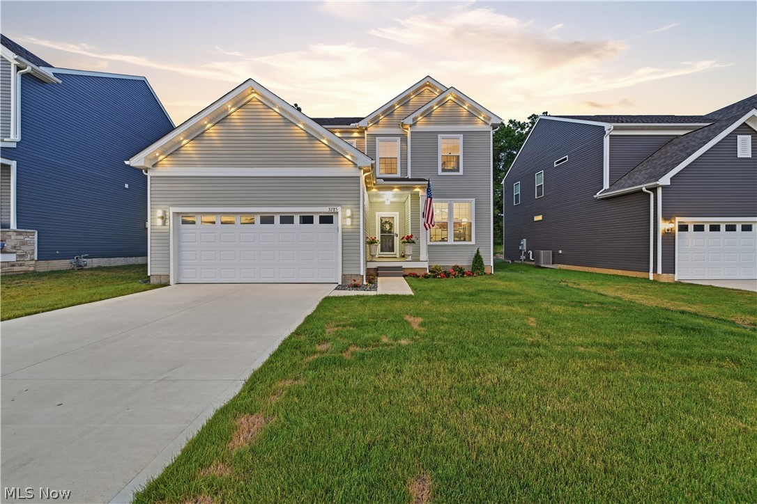 Welcome home to 3785 Rachael Lane in Uniontown!! This is a twilight photo session, so you can see the exterior lighting!