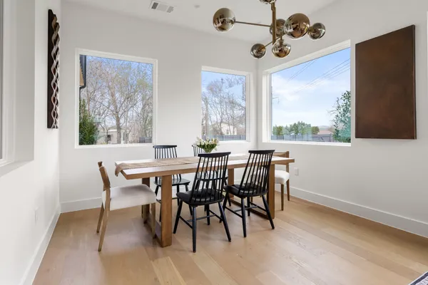 a view of a dining room with furniture window and outside view